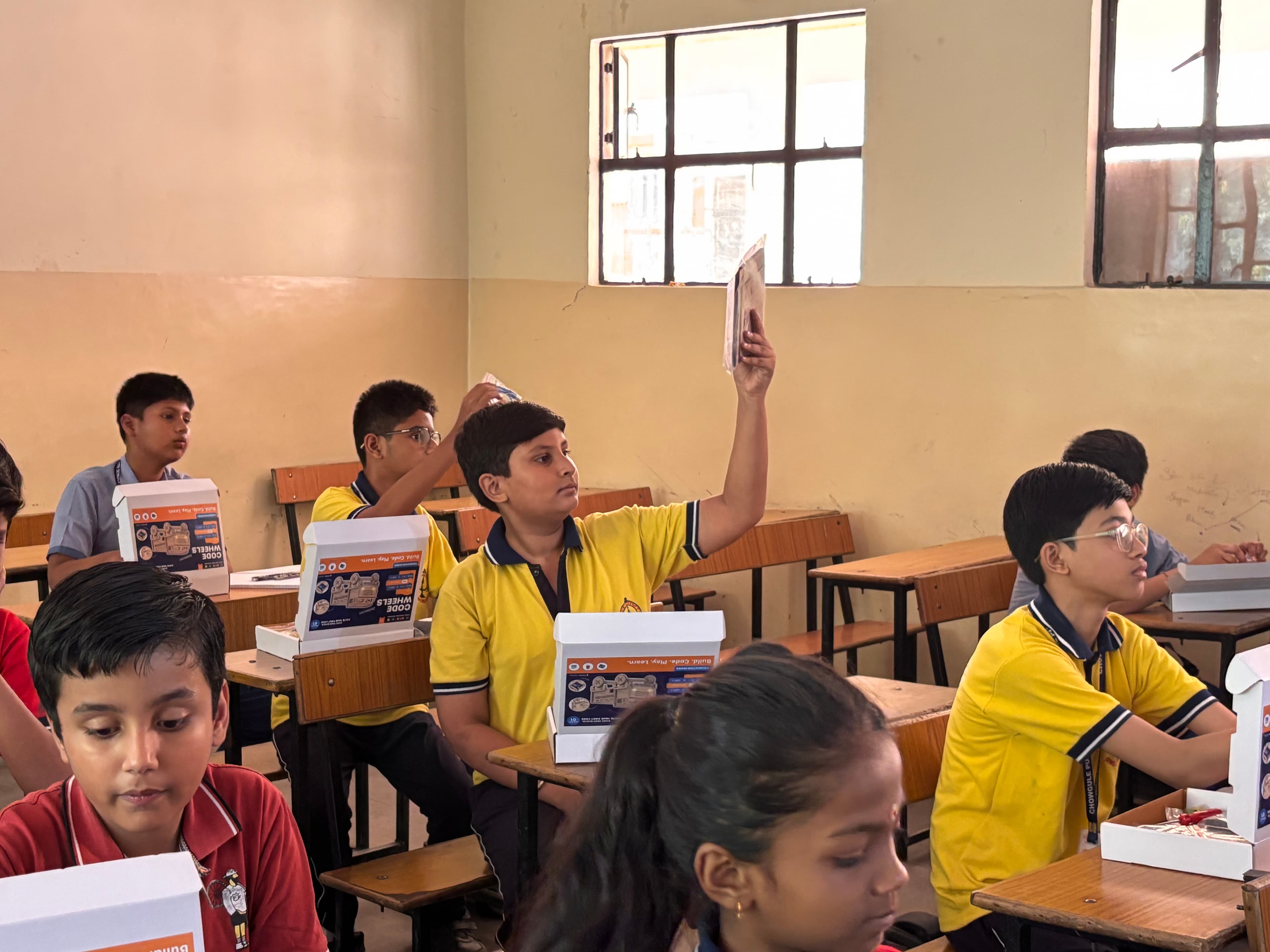 A student working with a StepSTEM learning kit